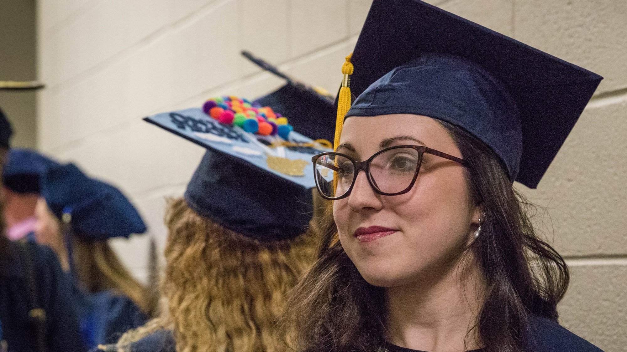 A School of Medicine student waits in line in a 2019 ceremony.
