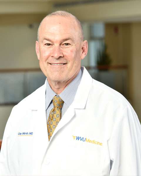 A headshot of Clay Marsh, Vice President & Executive Dean for Health Sciences, wearing his white coat.