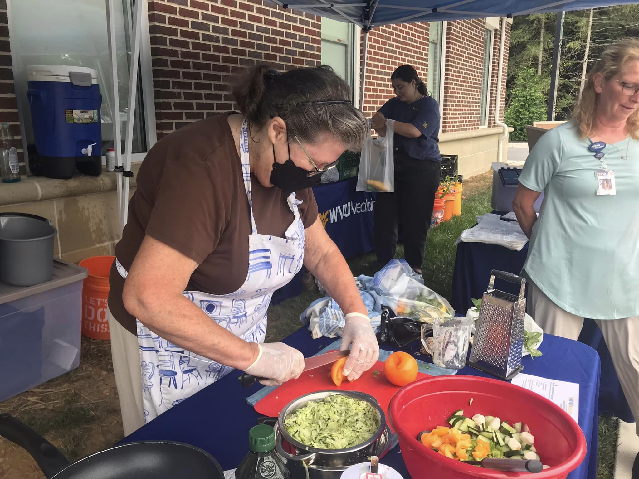 Volunteer prepares food